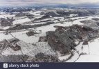 aerial-view-of-winter-landscape-in-mosebolle-with-horse-farm-near-meschede-in-winter-with-snow...jpg