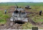 early production M4A1  and an M3 Lee tank during field tests by 1 Komp Panzer Abt 501 at the K...jpg