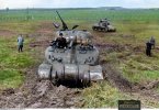 early production M4A1  and an M3 Lee tank during field tests by 1 Komp Panzer Abt 501 at the K...jpg